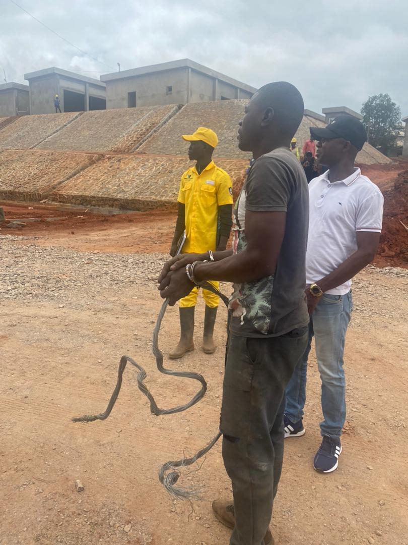 FIDEMAX security guards and officials with the arrested suspected thief.